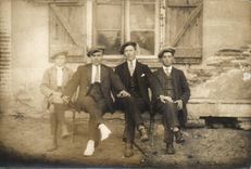 Real photo Men on a bench (folklore costume caps)