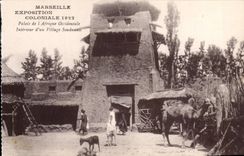 CPA Marseille Exposition coloniale 1922 Palais de l'Afrique occidentale Interieur d'un village soudanais Camel Chameau
