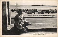 CPA sands Olonne a corner of beach has horizon the piers of the port Coiffe Folklore costume