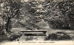 VINTAGE POSTCARD Park of rustic Chantilly Bridge of the Hamlet