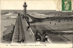 La POSTAL Trouville de la VENDIMIA el embarcadero y la playa tiene marea baja