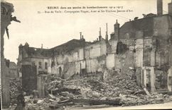 VINTAGE POSTCARD Rheims In its years of Bombardments Street of Vesle Companies Singer Auer and the stamps Jeanne D arc