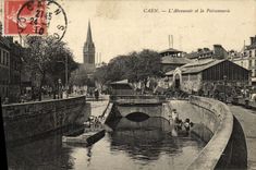 La POSTAL Caen L canal de alimentacion y el pescado de la VENDIMIA hace compras