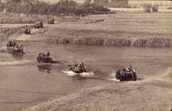 VINTAGE POSTCARD Militaria Group motor bike passing a ford