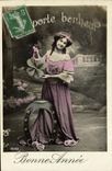 VINTAGE POSTCARD Happy New Year Woman Carries Happiness Clover Horseshoe