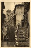 VINTAGE POSTCARD Roquebrune Old woman street dominee by the Fort