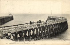 VINTAGE POSTCARD Courseulles two Piers