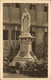 CPA Statue de Sainte Therese de l'Enfant Jesus dans la cour d'entree du Carmel de Lisieux