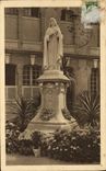 CPA Statue de Sainte Therese de l'Enfant Jesus dans la cour d'entree du Carmel de Lisieux