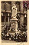 CPA Statue de Sainte Therese de l'Enfant Jesus dans la cour d'entree du Carmel de Lisieux