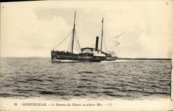VINTAGE POSTCARD Ouistreham the boat of the harbor on the open sea