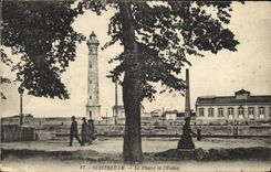 VINTAGE POSTCARD Oustreham the headlight and the factory