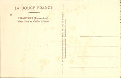 Puente del viejo hombre de Chartres de la POSTAL de la VENDIMIA y casas viejas