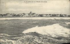 Arenas de la POSTAL de la VENDIMIA del mar lleno del olonne