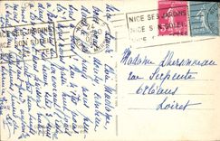 Dimensión artística de la POSTAL de la VENDIMIA de Niza azul vista entre los pinos