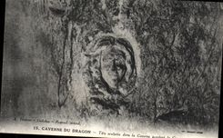 VINTAGE POSTCARD Cave Of the Dragon Sculptee Head in the cave during the war