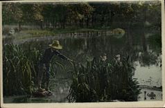 VINTAGE POSTCARD Child at the edge of a pond