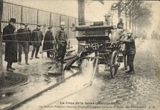 VINTAGE POSTCARD Sapeurs Paris Firemen the rising of the Seine Eau of the cellars of the Wine market has Bercy