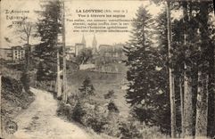 VINTAGE POSTCARD Louvesc Seen Through the Fir trees