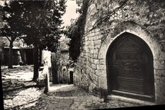 Dimensión de la POSTAL de la VENDIMIA de la aldea azul de Eze una puerta vieja y el lugar del flanet