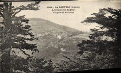 VINTAGE POSTCARD Louvesc Through the Fir trees Seen from of Rochelipe