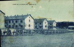VINTAGE POSTCARD Militaria Camp of Courtine Building B Guns