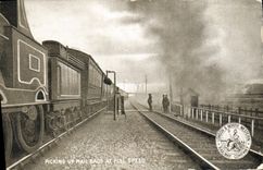 VINTAGE POSTCARD Train Engine Picking up email bags At full speed London & North Railway Company