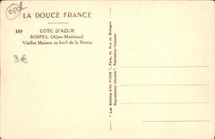 VINTAGE POSTCARD Sospel Old woman Houses at the edge of Bevera