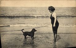 VINTAGE POSTCARD Woman Bathing suit Dog
