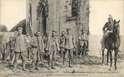 VINTAGE POSTCARD Militaria German Prisoners in a village close to Arras