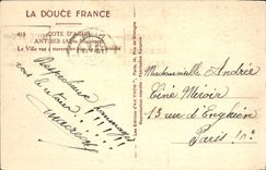 POSTAL Antibes de la VENDIMIA la ciudad vista a través de los pinos de la cornisa