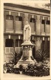 VINTAGE POSTCARD the statue of Sainte Therese of the Jesus Child in the court of entry of Carmel de Lisieux
