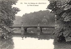 VINTAGE POSTCARD Park of the castle of Chantilly the bridge of love