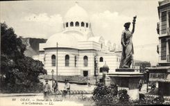 VINTAGE POSTCARD Statue of freedom and the cathedral Oran Algeria