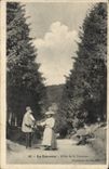 CPA La Louvesc Allee de la Fontaine Mendiant Femme
